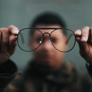 Man looking through glasses